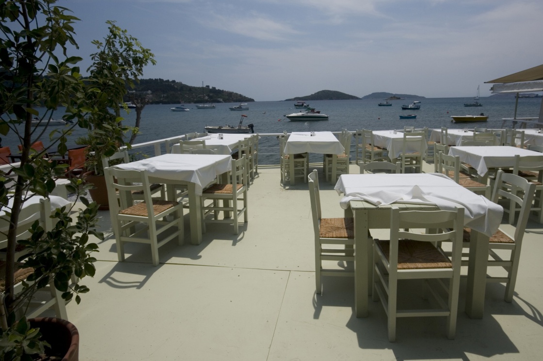 'Dining tables in local restaurant with a view of the sea Skiathos, Greece' - Σκιαθος